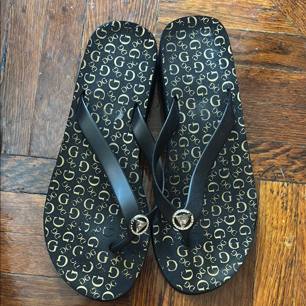 Guess Black Flip Flops with Gold Accents